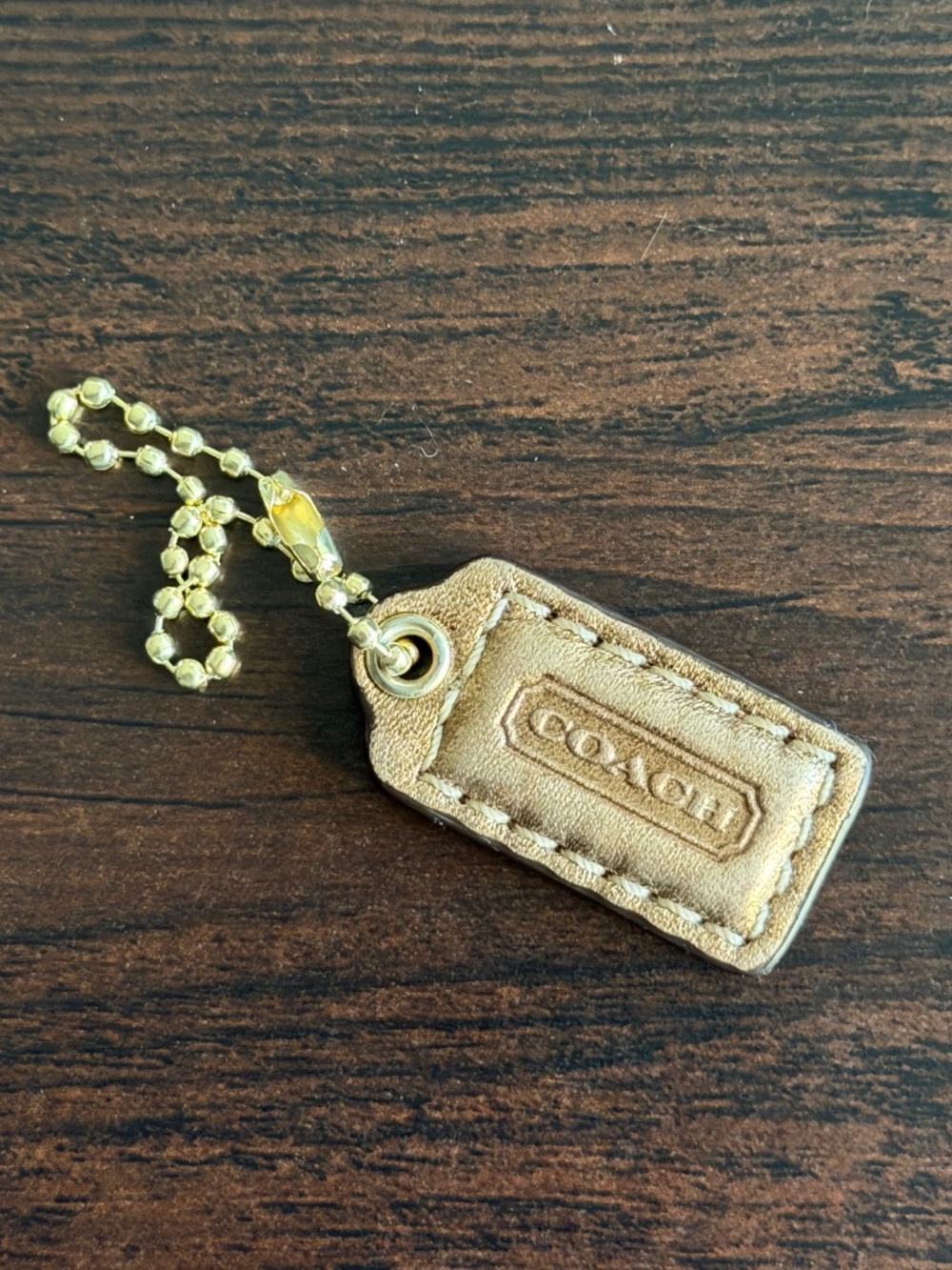 Coach copper leather hangtag